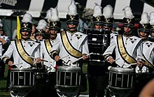 The Spirit of Gold Marching Band plays Vanderbilt's fight song, "Dynamite" Spirit of Gold Drums.jpg