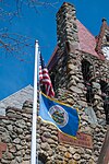 The flag of Swansea, in front of its town hall