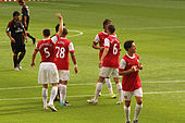 Vermaelen (left) with Arsenal in 2010 Thomas Vermaelen, Kieran Gibbs, Laurent Koscielny & Samir Nasri (4867513848).jpg