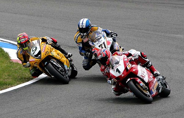 James Toseland (1) on a Ducati leads Chris Walker (9) on a Kawasaki and Yukio Kagayama (71) on a Suzuki during a 2005 Superbike World Championship rac