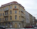 Apartment house in a corner and closed development