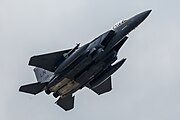 An F-15E Strike Eagle, tail number 97-0218, taking off from RAF Lakenheath in England. The aircraft is assigned to the 492nd Fighter Squadron.