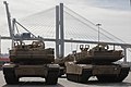 Soldiers assigned to 2nd Brigade Combat Team wait to move M1A1 Abrams tanks aboard a military transport vessel in support of DEFENDER-Europe 20 at the Port of Savannah, Ga. February 12, 2020.