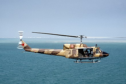A Bahrain Air Force Agusta-Bell 212 Twin Huey in flight over the Persian Gulf during a training mission in 1991