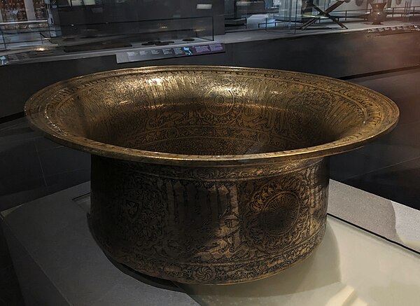 Basin with an inscription in Arabic that reads: "Made by the order of Hugh, favoured by God, the one at the vanguard of the elite troops of the Franks