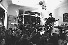 Bastille performing at the Sofar Sounds x War Child charity event in London. Bastille - War Child Sofar Show (23.02.15).jpg