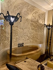 Bath of Jeanne Lanvin, of Sienna marble, with decoration of carved stucco and bronze (1922–25)