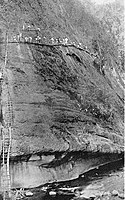 Benguet Road construction crew near Camp 5, Tuba, Benguet ca1903 setting explosives into a sheer cliff of the Bued River Canyon. Benguet Road construction near Camp 5.jpeg