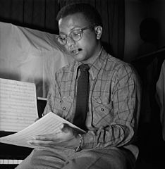 Image 13Billy StrayhornPhotograph credit: William P. Gottlieb; restored by Adam CuerdenBilly Strayhorn (November 29, 1915 – May 31, 1967) was an American jazz composer, pianist, lyricist, and arranger, best remembered for his long-time collaboration with bandleader and composer Duke Ellington that lasted nearly three decades. Though classical music was Strayhorn's first love, his ambition to become a classical composer went unrealized because of the harsh reality of a black man trying to make his way in the world of classical music, which at that time was almost completely white. He was introduced to the music of pianists like Art Tatum and Teddy Wilson at age 19, and the artistic influence of these musicians guided him into the realm of jazz, where he remained for the rest of his life. This photograph of Strayhorn was taken by William P. Gottlieb in the 1940s.More selected pictures