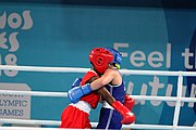 Deutsch: Boxen bei den Olympischen Jugendspielen 2018 Tag 12, 18. Oktober 2018 - Finale Fliegengewicht Mädchen – Martina La Piana (Italien, blau) schlägt Adijat Gbadamosi (Nigeria, rot) 5-0; Ringrichter ist James Beckles (Trinidad und Tobago). English: Boxing at the 2018 Summer Youth Olympics on 18 October 2018 – Girl's flyweight Gold Medal Bout - Martina La Piana (Italy, blue) beats Adijat Gbadamosi (Nigeria, red) 5-0; Referee is James Beckles (Trinidad and Tobago). Español: Boxeo en los Juegos Olímpicos Juveniles de Verano de 2018 en 18 de octubre de 2018 - Combate a medalla de oro de peso mosca para mujeres: Martina La Piana (Italia, azul) le gana a Adijat Gbadamosi (Nigeria, roja) 5-0; El árbitro es James Beckles (Trinidad y Tobago).