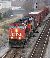 A Canadian National Railway train showing the placement of the headlight and ditch lights on the locomotive. Canadian National diesels southbound on the Norfolk Southern near Polaris Mall in Columbus, Ohio (2092116881).jpg