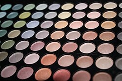 An eye shadow palette with a wide variety of neutral and vibrant colors Colours - make up.jpg