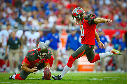 Tampa Bay Buccaneers placekicker Connor Barth attempts a field goal by kicking the ball from the hands of a holder. This is the standard method to score field goals or extra points.[95][96]