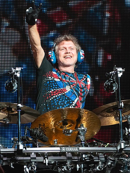 After losing his left arm in a car accident, drummer Rick Allen (pictured in 2018) used his feet to play a custom electronic drum kit.