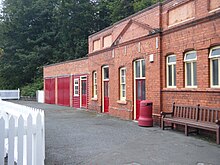 The old stable block, inclduing toilets; the stables have now been converted into garages and former souvenir shop to the right which is now a preparation area for the railway's dining train service. Douglas Station Stables.jpg