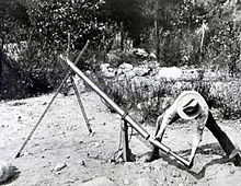 Goddard loading a bazooka in 1918