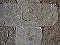 Inscriptions diverses gravées sur le mur extérieur de l'église Saint-Pierre de Granchain (face Sud)