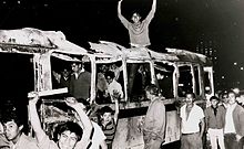 Students in a burned bus during the protests of 1968 Estudiantes sobre cammion quemado (A68).JPG