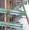 Twin steel walers and tie bolts used to secure wall forms