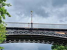 centre of a single-span metal bridge with lamp-post; the words "Galton Bridge" are cast into the metal