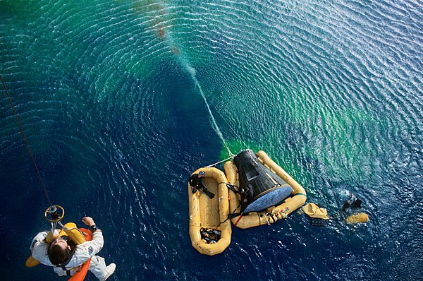 Young being hoisted from the capsule following his Gemini 10 flight