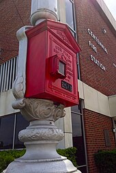 An original Gamewell Fire Alarm Box in front of Centennial Fire Station No. 1.