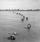 Indian troops wade ashore at Akyab, Burma, January 1945. SE2418.jpg