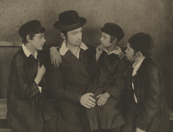 Jacob Kalich (second from left), Picon's husband, in the comedy play Mezrach und Maarev, 1921