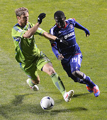 Jeff Parke of the Seattle Sounders is defending against attacking midfielder Patrick Nyarko of the Chicago Fire (Saturday, April 28, 2012) JeffParke defending Patrick Nyarko.jpg