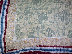 Closeup of a kantha. In the left and bottom Paar is shown, also the running stitches (white) are seen. Kantha Closeup.jpg