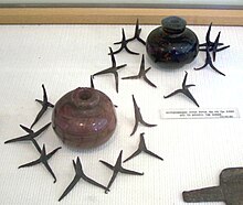 Hand grenades filled with Greek fire; surrounded by caltrops (10th-12th centuries National Historical Museum, Athens, Greece) Liquid fire granades Chania.jpg