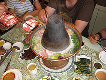 Mongolian style traditional coal-heated Hot pot Huo-Guo dining