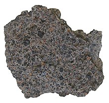 The lithology of this porphyritic basalt is characterized by olivine and augite phenocrysts. Olivine basalt.jpg