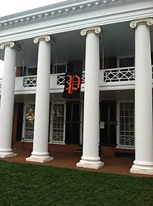 A banner with a scripted "P", representing the P.U.M.P.K.I.N. Society, hanging from a pavilion at the University of Virginia. P.U.M.P.K.I.N. Society Banner.jpg