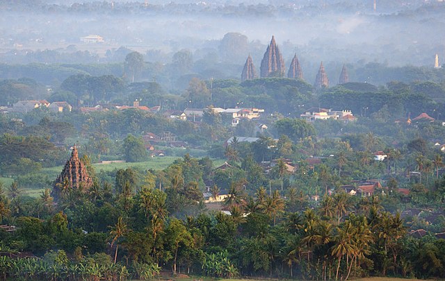 Sojiwan temple is on the bottom left and Prambanan temple is on the top right, in the center of Prambanan Plain viewed from Ratu Boko Hill.