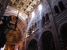 The coffered ceiling, 16th century fresco, angel candle holder, and Saint John by Cimabue (mosaic detail) Pisa duomo inside.jpg