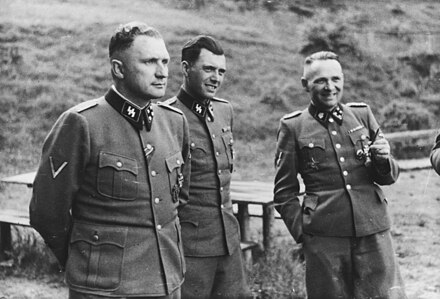 (from l. to r.) Richard Baer, Josef Mengele, and Rudolf Höss in Auschwitz, 1944 (Höcker Album)