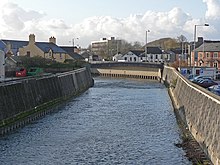 The Ogmore and its tributaries were confined to narrow concrete channels to prevent flooding River Ogmore - Bridgend - geograph.org.uk - 1606360.jpg