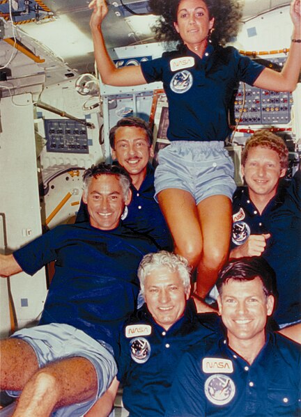 Resnik poses with the rest of the Space Shuttle Discovery crew during the STS-41-D mission.