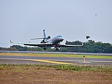 An Indonesian Air Force Dassault Falcon 8X landing at Halim Perdanakusuma AFB Selamat datang Pesawat Falcon 8X A-0801 di Skadron Udara 17 -2.jpg