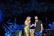 Mehmet Erdem performing with Sezen Aksu at Cemil Topuzlu Open-Air Theatre, 2012