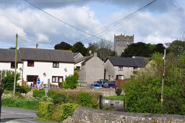 The village and parish church in the distance