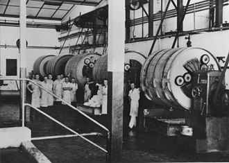 Workers inside the churn room, 1938 StateLibQld 1 205388 Workers inside the churn room of the butter factory, Kingaroy, 1938.jpg