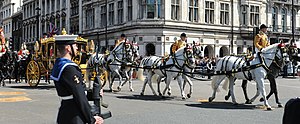 Postilions control the horses drawing the Queen's Coach at the State Opening of Parliament, London 2015 State Opening of Parliament 2015 (18168840775) (cropped).jpg