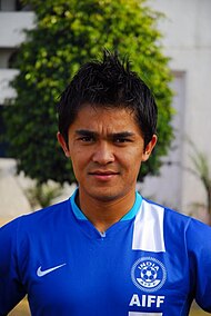 Portrait of Sunil Chhetri in blue shirt.