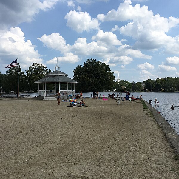 Sunset Lake provides recreational opportunities for residents. The steeple in the background is part of the South Congregational Church.