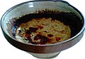 Teurgoule normande cuite dans le plat traditionnel.
