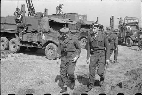 Lieutenant General N. M. Ritchie, GOC XII Corps, with his ADC during an inspection of bridging parties on the Rhine, March 1945.