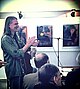 Tibor Vass smiles and claps after István Turczi's poem at Vass' exhibition-Miskolc.jpg