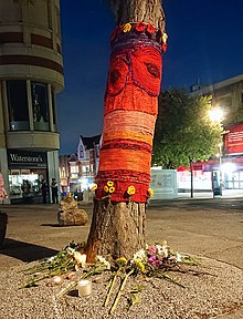 "Tree of remembrance" decorated with yarn-bombing near the bench Tree of Remembrance, Trinity Square, Sutton SM1.jpg
